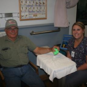 Picture of therapist with a patient in a therpay session